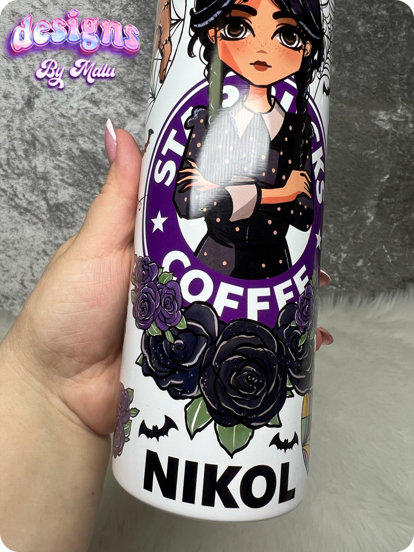 Personalised Wednesday Addams Starbucks Coffee Tumbler, featuring a gothic-style cartoon character with black braids, surrounded by purple roses and bats. This 20oz straight tumbler is beautifully designed with a ‘starbucks Coffee’ inspired logo and can be customised with any name. Perfect as a gift for her, this tumbler comes complete with a lid and straw, making it both stylish and functional for everyday use.